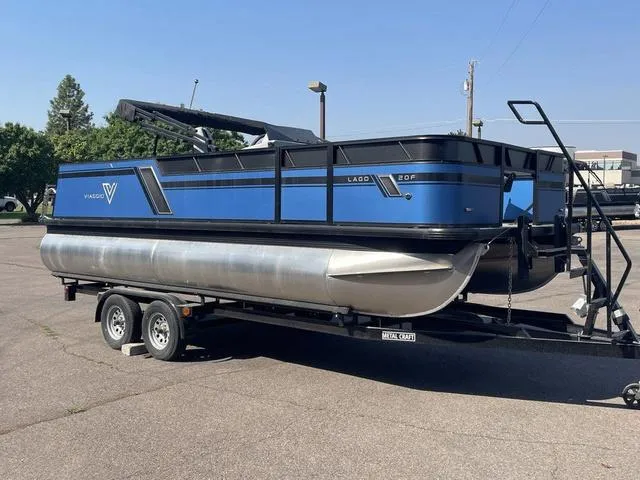 Slide: The Image of 2023 Viaggio L20F pontoon boat on a trailer in a parking lot. - 3
