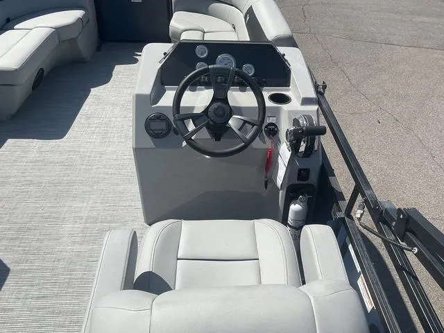Slide: The Image of Viaggio DM20C 2023 boat interior with steering wheel and seating. - 11