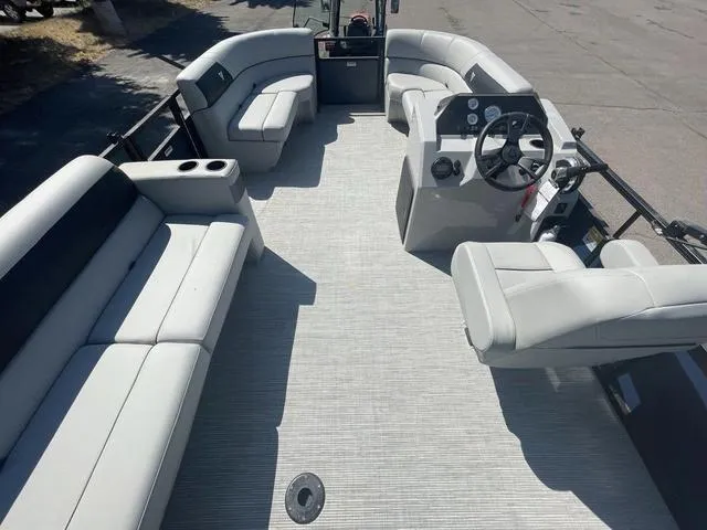 Slide: The Image of 2023 Viaggio DM20C pontoon boat interior with spacious seating and modern helm. - 12