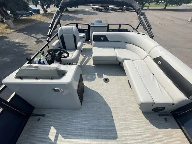 Slide: The Image of 2023 Viaggio DM18F pontoon boat interior with helm and spacious seating. - 10