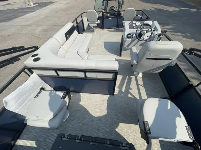 Slide: The Image of 2023 Viaggio DM18F pontoon boat interior with seating and steering console. - 13