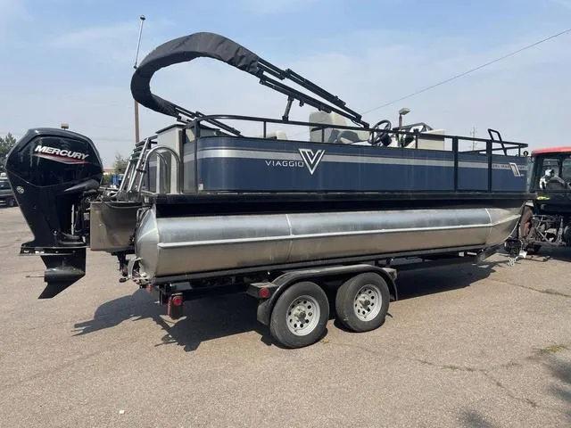 Slide: The Image of 2023 Viaggio DM18F pontoon boat on trailer with Mercury outboard motor. - 4