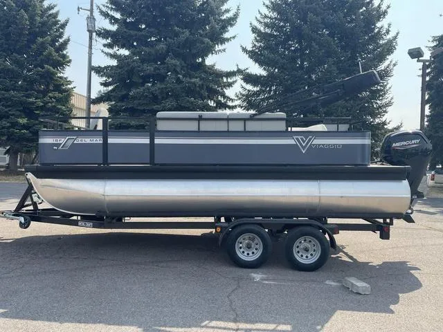 Slide: The Image of 2023 Viaggio DM18F pontoon boat on trailer with Mercury outboard motor. - 7