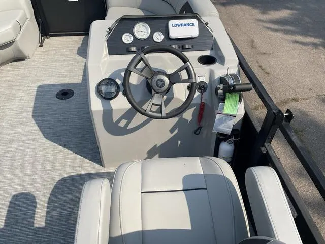 Slide: The Image of 2023 Viaggio DM18U boat dashboard with steering wheel and Lowrance navigation system. - 12