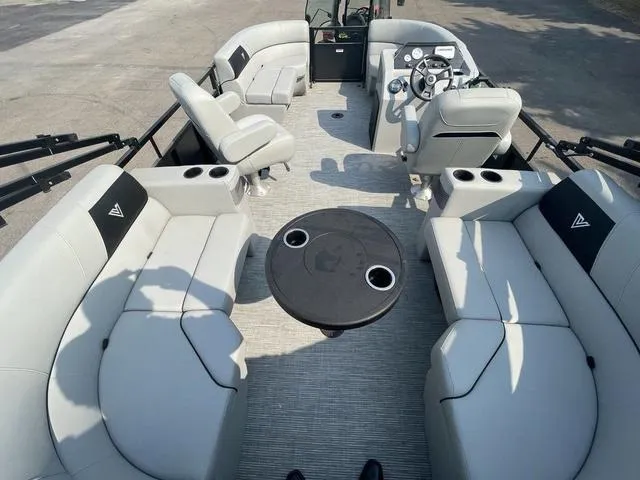 Slide: The Image of 2023 Viaggio DM18U pontoon boat interior with seating and table. - 13