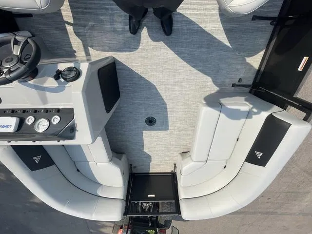 Slide: The Image of 2023 Viaggio DM18U boat interior with gray seating and steering console. - 14