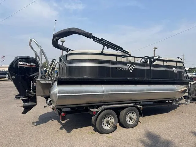 Slide: The Image of 2023 Viaggio DM18U pontoon boat on a trailer with Mercury outboard motor. - 4