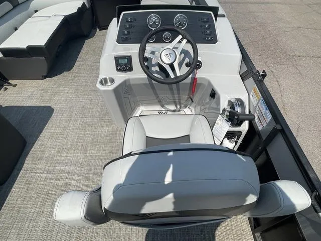 Slide: The Image of 2023 Viaggio L20C boat cockpit with steering wheel and control panel. - 9