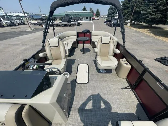 Slide: The Image of 2023 Viaggio l20u pontoon boat with beige seating and black canopy. - 10