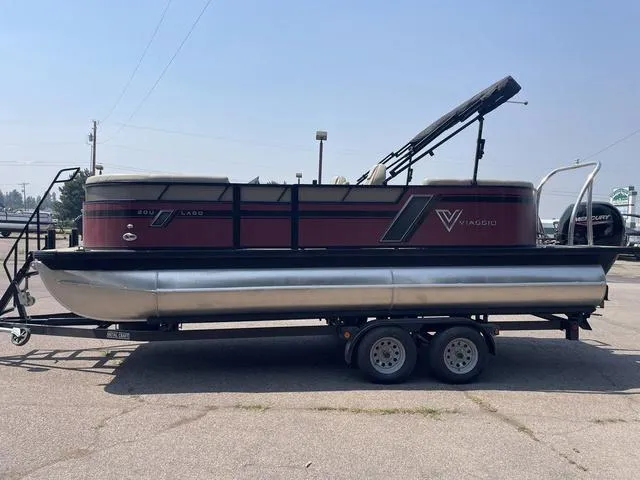 Slide: The Image of 2023 Viaggio l20u pontoon boat on a trailer in a parking lot. - 4