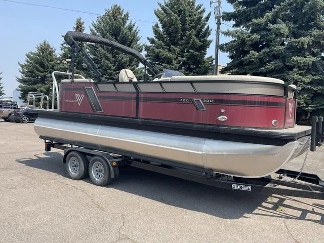 Slide: The Image of 2023 Viaggio l20u pontoon boat on trailer, red and black design. - 7
