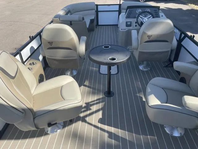 Slide: The Image of 2023 Viaggio L22Q boat interior with beige seating and central table. - 11
