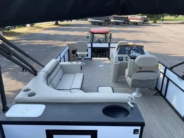 Slide: The Image of 2023 Viaggio LAGO 22F pontoon boat interior with seating and helm. - 10