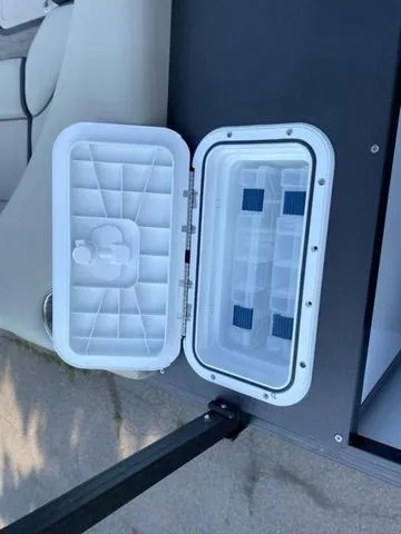 Slide: The Image of Open storage compartment on 2023 Viaggio LAGO 22F boat. - 11