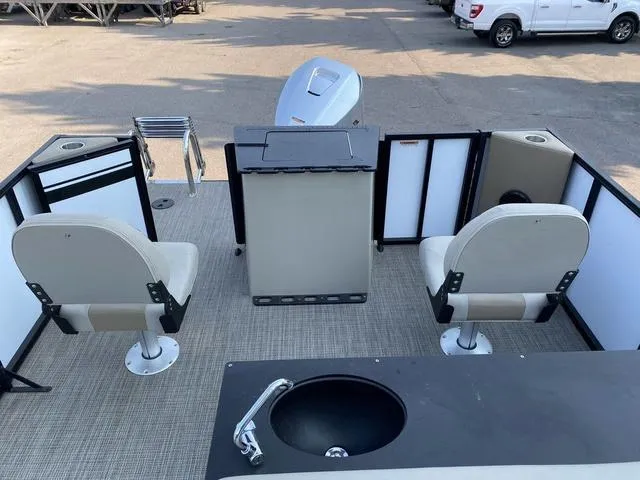 Slide: The Image of 2023 Viaggio LAGO 22F boat interior with seating and motor. - 13