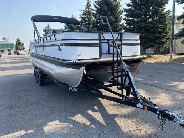 Slide: The Image of 2023 Viaggio LAGO 22F pontoon boat on trailer in parking lot. - 3