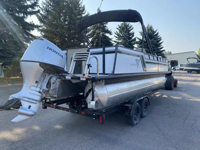Slide: The Image of 2023 Viaggio LAGO 22F pontoon boat with Honda outboard motor on trailer. - 5
