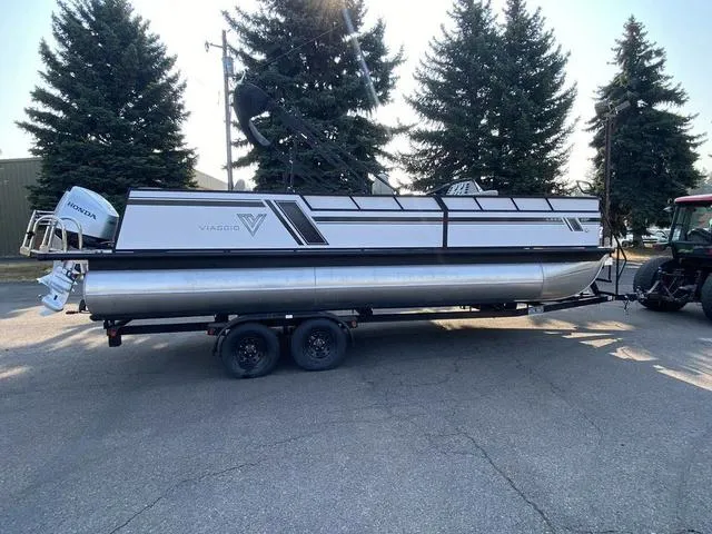 Slide: The Image of 2023 Viaggio LAGO 22F pontoon boat on trailer with Honda outboard motor. - 6