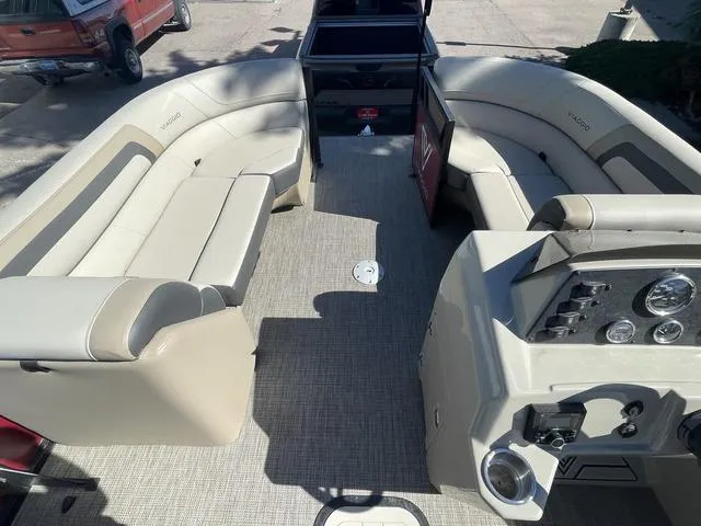 Slide: The Image of 2023 Viaggio L22T boat interior with beige seating and modern dashboard. - 12