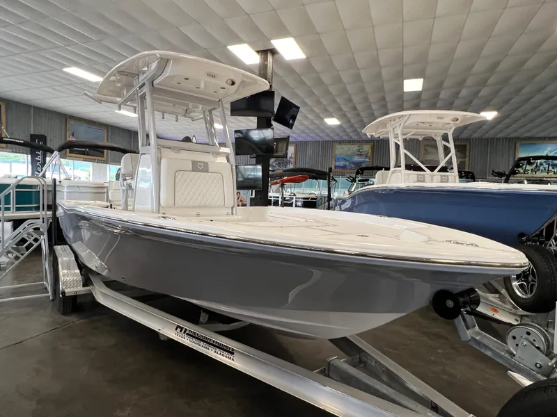 The Image of 2024 Sea Fox 231 Bay boat on display in a showroom. - 0