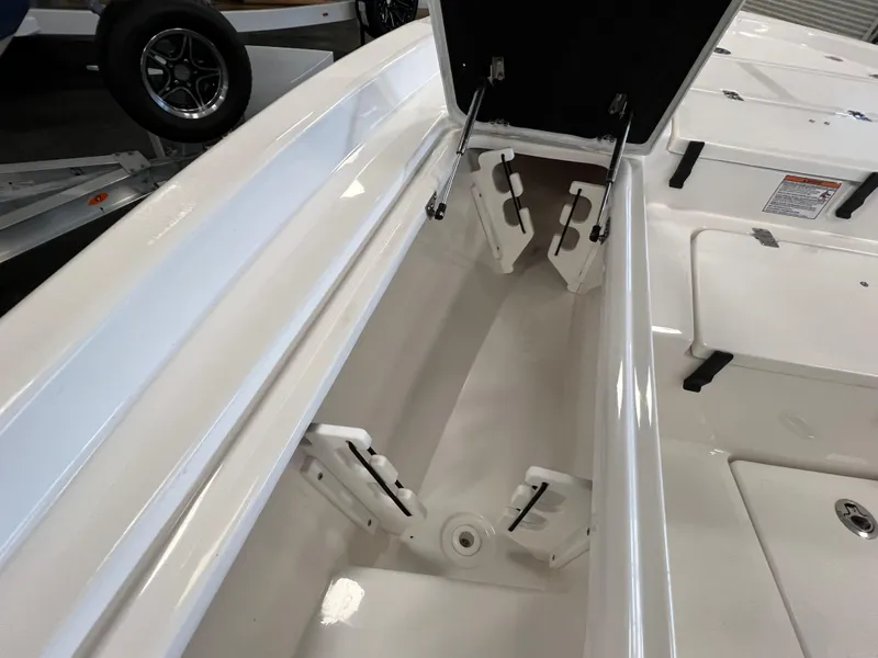 Slide: The Image of 2024 Sea Fox 231 Bay boat storage compartment with open hatch. - 10