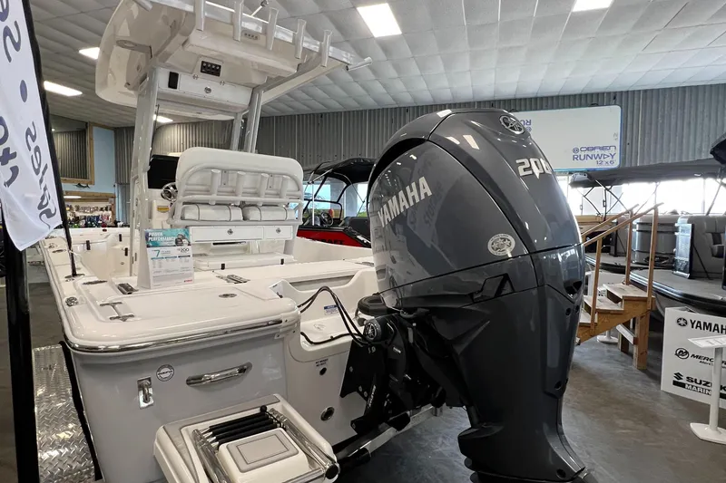 Slide: The Image of 2024 Sea Fox 231 Bay boat with Yamaha 200 outboard motor in showroom. - 2
