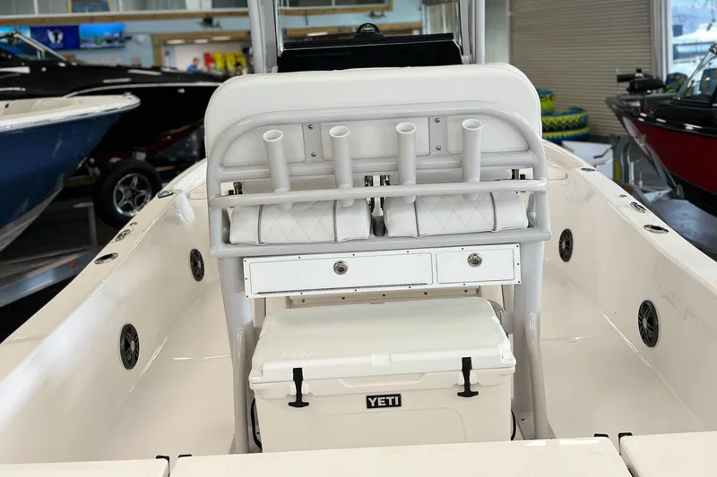 Slide: The Image of 2024 Sea Fox 231 Bay boat interior with Yeti cooler and rod holders. - 3