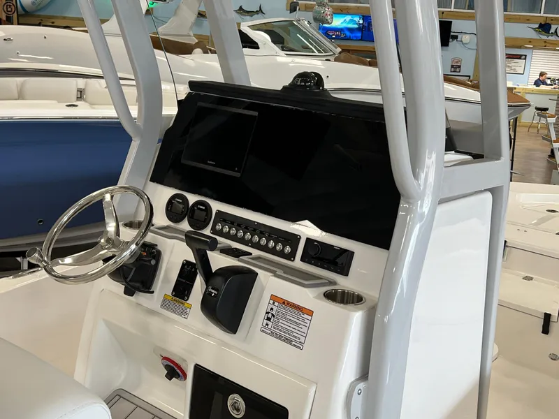 Slide: The Image of 2024 Sea Fox 231 Bay boat console with steering wheel and control panel. - 4