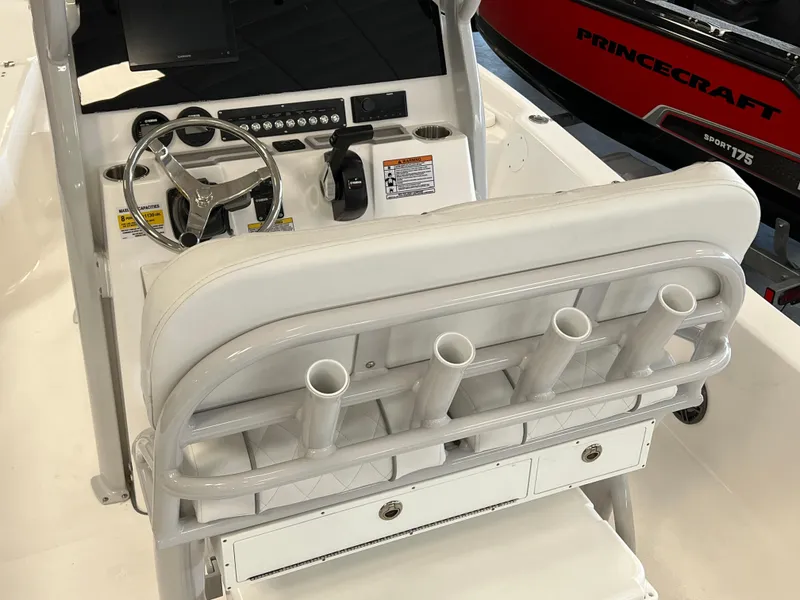 Slide: The Image of 2024 Sea Fox 231 Bay boat console with steering wheel and rod holders. - 5