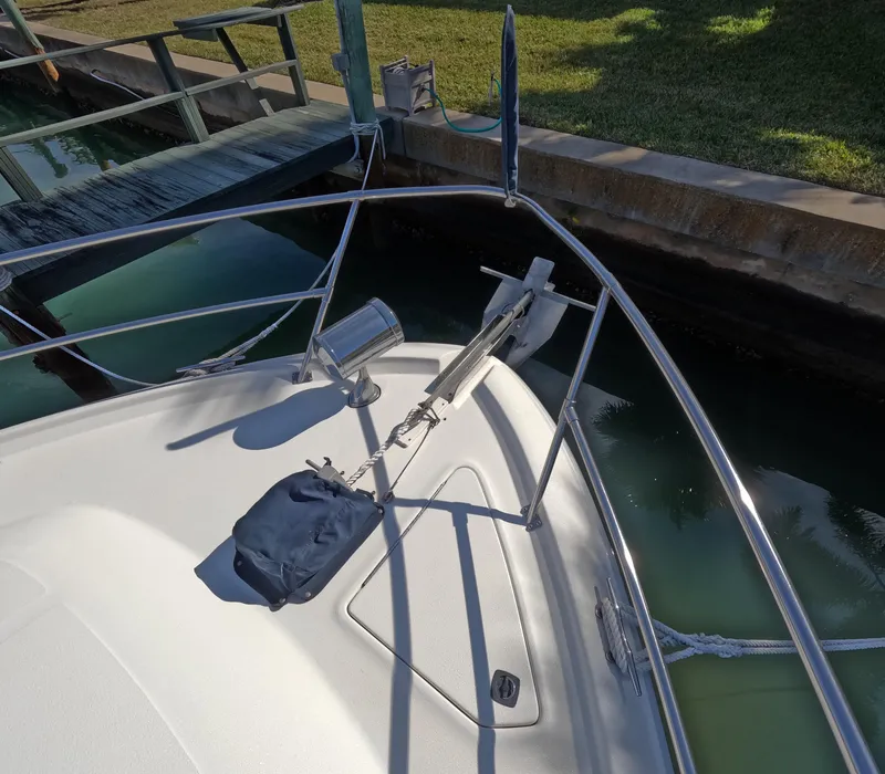 Slide: The Image of 1995 Sea Ray 370 Sundancer bow with anchor and docked at marina. - 11