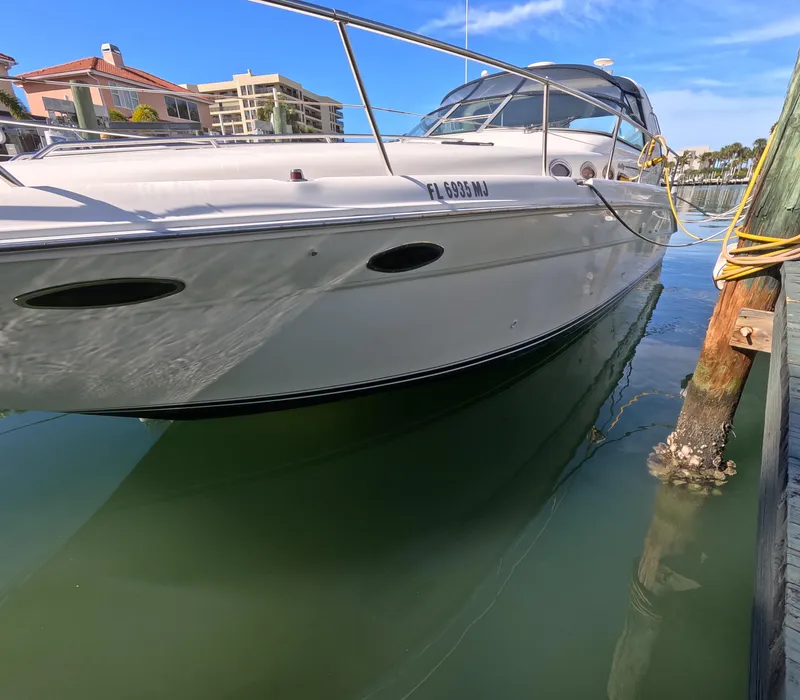 Slide: The Image of 1995 Sea Ray 370 Sundancer docked in marina, side view. - 19