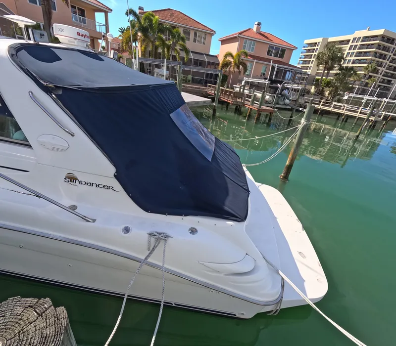 Slide: The Image of 1995 Sea Ray 370 Sundancer docked in a marina with waterfront homes. - 20