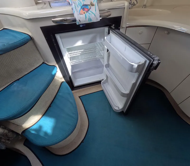 Slide: The Image of Open refrigerator in the cabin of a 1995 Sea Ray 370 Sundancer boat. - 28