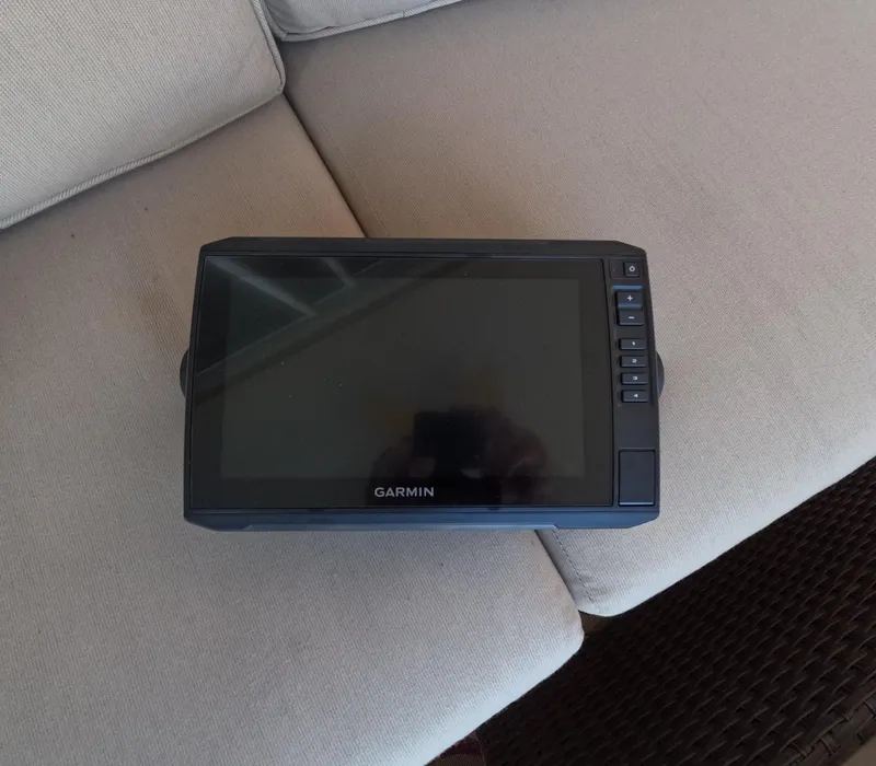 Slide: The Image of Garmin marine GPS device on a beige cushion, 1995 Sea Ray 370 Sundancer. - 34