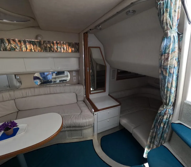 Slide: The Image of Interior of 1995 Sea Ray 370 Sundancer with seating area and table. - 4