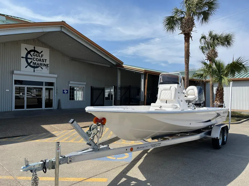 Slide: The Image of 2023 Blue Wave 2200 STL boat on trailer at Gulf Coast Marine dealership. - 1