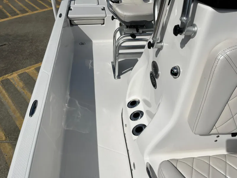 Slide: The Image of 2023 Blue Wave 2200 STL boat interior with seating and rod holders. - 15