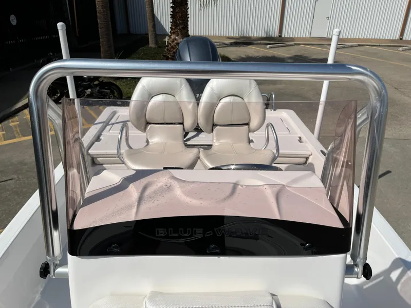 Slide: The Image of 2023 Blue Wave 2200 STL boat with dual seats and windshield. - 16