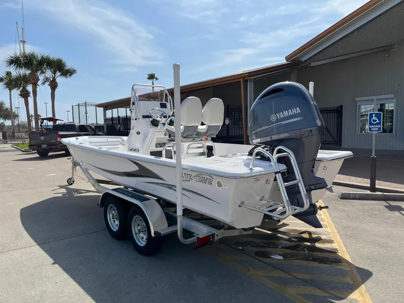 Slide: The Image of 2023 Blue Wave 2200 STL boat on trailer with Yamaha outboard motor. - 7