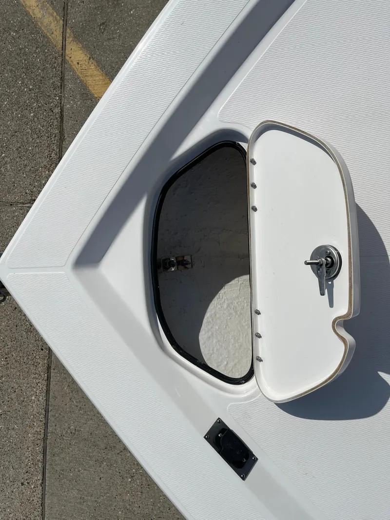 Slide: The Image of 2023 Blue Wave 2200 STL boat storage compartment with open hatch. - 9