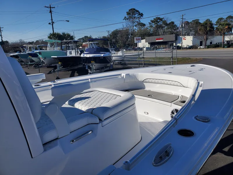 Slide: The Image of 2024 Sportsman Masters 267OE Bay boat interior with seating and storage. - 2