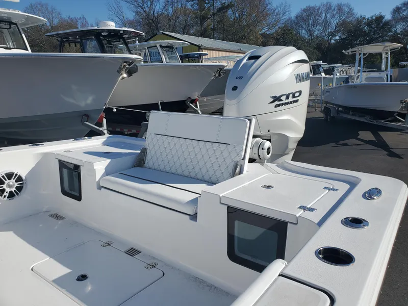 Slide: The Image of 2024 Sportsman Masters 267OE Bay boat with Yamaha XTO engine in a marina. - 5