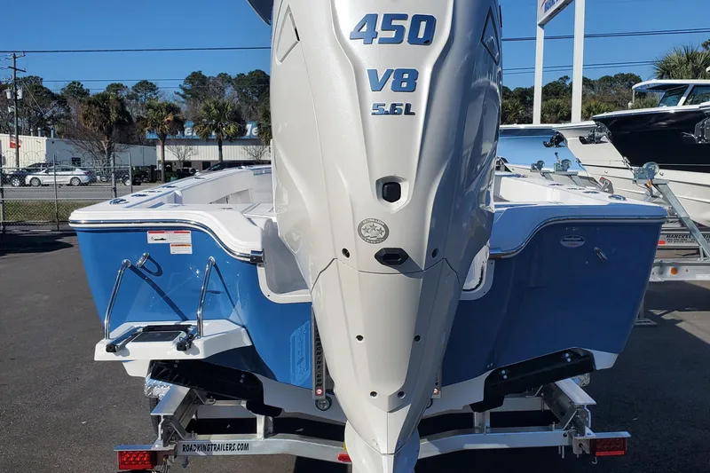 Slide: The Image of 2024 Sportsman Masters 267OE Bay boat with 450 V8 engine, rear view. - 6