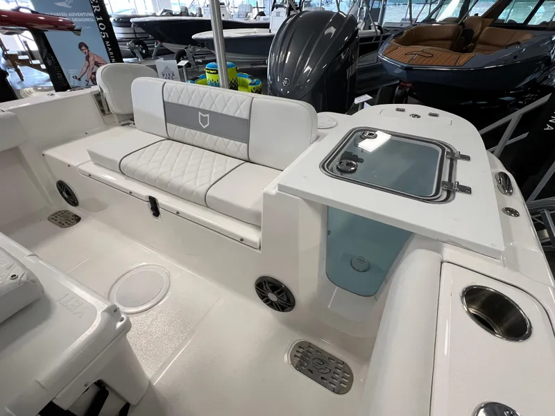 Slide: The Image of 2024 Sea Fox 228 Commander boat interior with seating and storage compartments. - 8