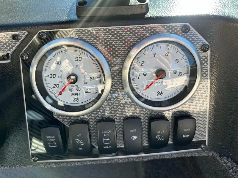 Slide: The Image of Dashboard of 2024 Lund 1650 Angler Sport boat with speedometer and tachometer. - 18
