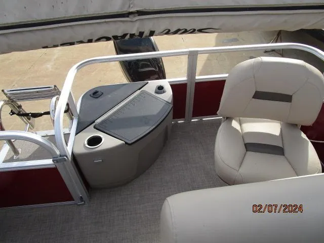 Slide: The Image of 2023 Sun Tracker Bass Buggy 18 DLX pontoon boat interior with seating and storage. - 5