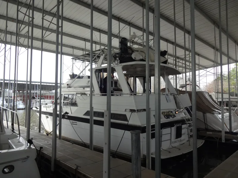 Slide: The Image of 1989 Hi-Star AFT Cabin Sundeck Motor Yacht docked in a covered marina. - 0