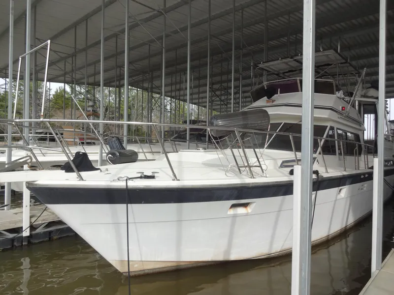 Slide: The Image of 1989 Hi-Star AFT Cabin Sundeck Motor Yacht docked in a covered marina. - 1