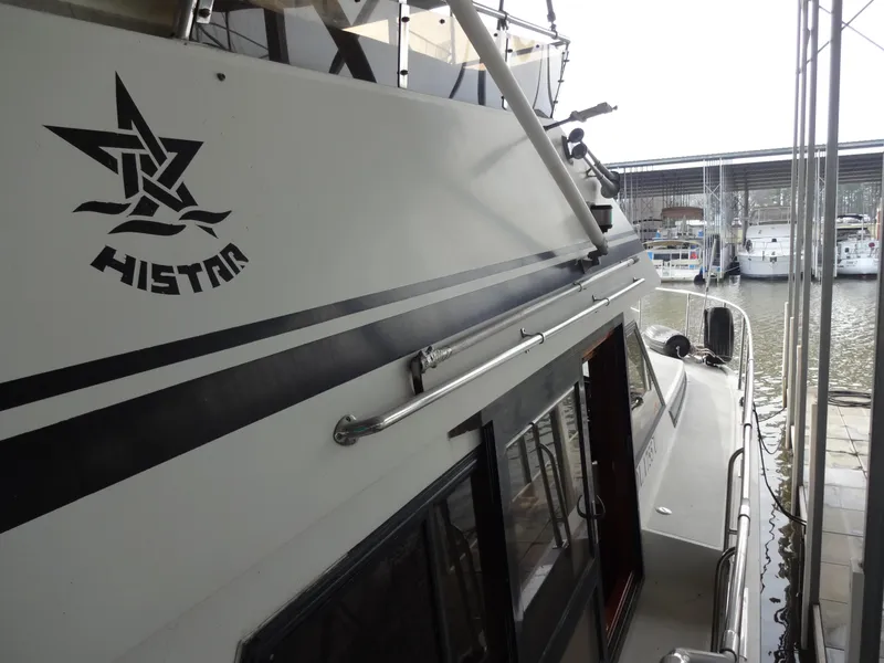 Slide: The Image of 1989 Hi-Star AFT Cabin Sundeck Motor Yacht docked at marina. - 11