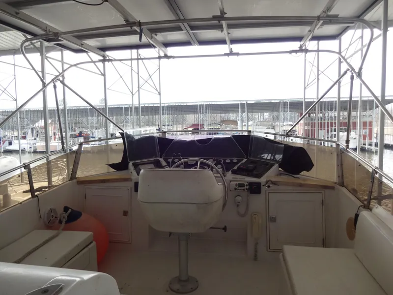 Slide: The Image of 1989 Hi-Star AFT Cabin Sundeck Motor Yacht helm station in marina. - 12